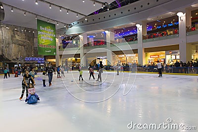 People skating in a mall with an indoor ice skating park Editorial Stock Photo