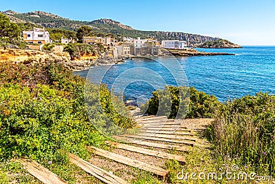 Mallorca island, beach in Sant Elm. Seashore, azure sea and buildings Stock Photo