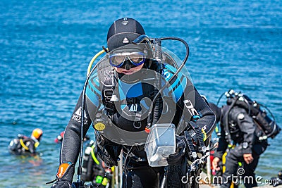 MalmÃ¶, Sweden - June 14, 2020: Scuba divers return after a scuba dive in the cold water of Oresund Editorial Stock Photo