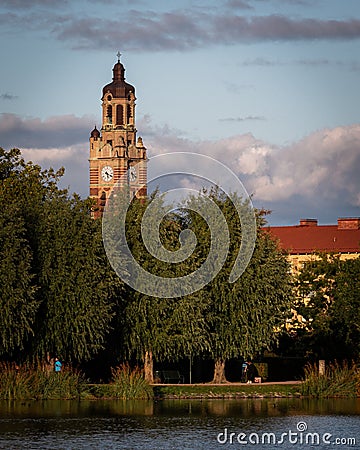 MalmÃ¶, Sweden - October 5, 2019: The church of St. Johannes is peeking up behind the trees in the park Pildammsparken during a Editorial Stock Photo