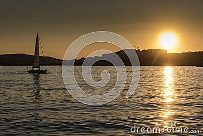 Sunset sailboat St Pauls Bay Malta Stock Photo