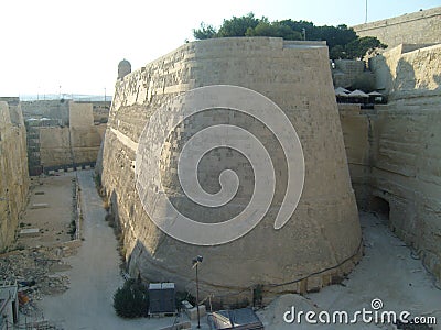 Malta La Valletta giant limestone ramparts roundly shaped old town fortification Stock Photo