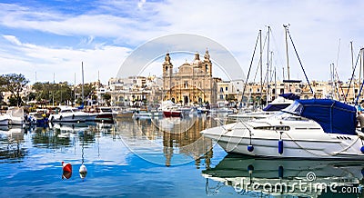 Malta - Msida cathedral and marina Stock Photo