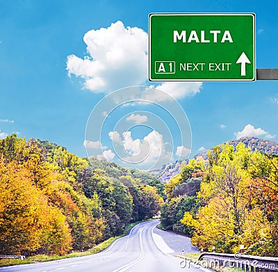 MALTA road sign against clear blue sky Stock Photo