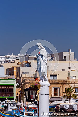 Malta. Saint guardian on the beach in the village of Marsaxlokk. Stock Photo