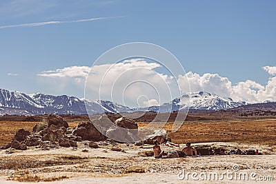 Wild Willy's Hot Springs with view of Easter Sierra Mountains on sunny day Editorial Stock Photo