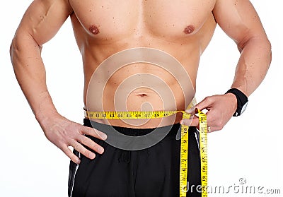 Man abdomen with measuring tape over blue background. Stock Photo