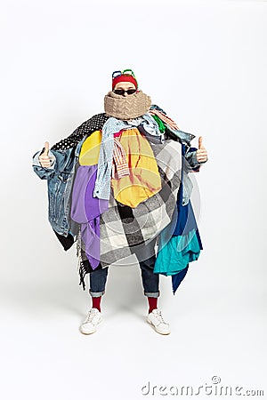 Man addicted of sales and clothes, overproduction and crazy demand Stock Photo