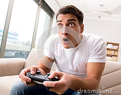 Man addicted to computer games Stock Photo