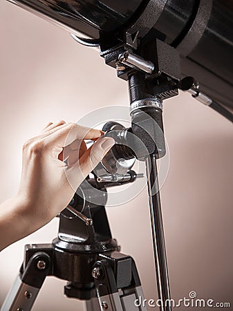 Man adjusts a telescope closeup Stock Photo