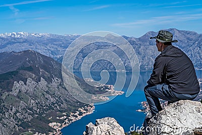Man admiring Kotor bay from above Stock Photo