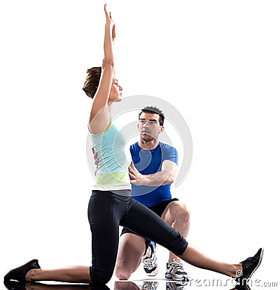 Man aerobic trainer positioning woman Workout Stock Photo