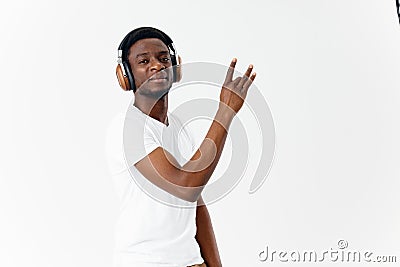 man of african appearance in headphones listening to music emotions fun Stock Photo