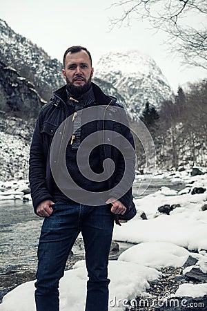 Man against river running from Stalheimsfossen waterfall in Naeroydalen valley, Norway Stock Photo