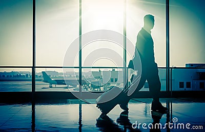 Man at the Airport with Suitcase Stock Photo