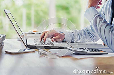 Man Analysis Business Accounting with hands pressing laptop but Stock Photo