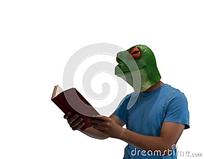 Man with an animal mask of a frog on his head enjoying reading a book on a white background Stock Photo