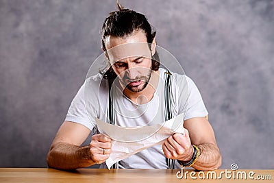 Man is annoyed about a letter Stock Photo