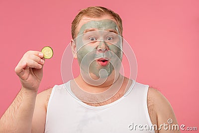 Man applies a mask of clay to cleanse the skin Grooming and skin care concept. Stock Photo