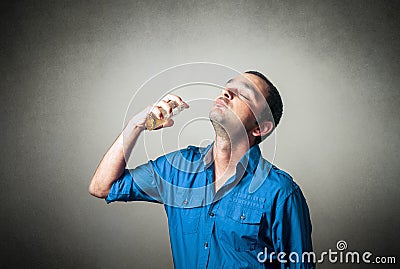 Man applying perfume Stock Photo