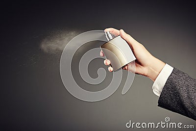 Man applying perfume Stock Photo