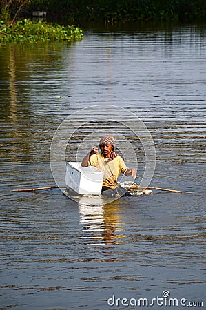 Man asia local fisher working by cast a net in canal country Thailand Editorial Stock Photo