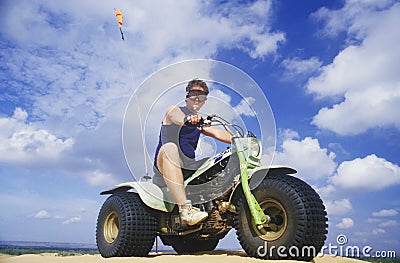 A man astride a 3-wheeled recreational vehicle in Little Sahara State Park, Oklahoma Editorial Stock Photo