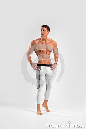 Man athlete isolated on white background. Gym full body workout. Muscular man athlete in fitness gym have havy workout Stock Photo