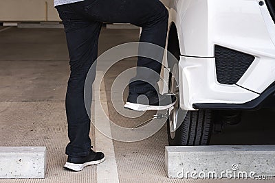 Man or auto mechanic worker change car tire or maintenance for safety Stock Photo