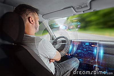 A man in an autonomous car. Self-driving. Concept autopilot, automotive engineering, artificial intelligence Stock Photo