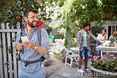 Man with back pack on his beck walking Stock Photo