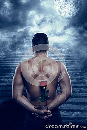 Man Back Rear View with Rose Flower Looking to Moon in Night Stock Photo