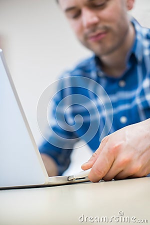Man Backing Up Computer Data Onto Memory Stick Stock Photo