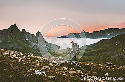 Man backpacker hiking in mountains alone outdoor Stock Photo