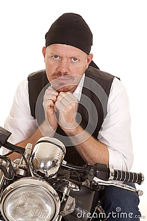 Man bandana motorcycle hands under chin Stock Photo