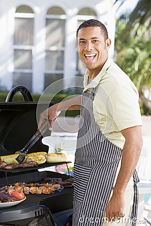 Man Barbequing In A Garden Stock Photo