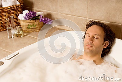 Man in bath Stock Photo
