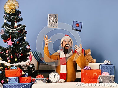Man with beard and excited face celebrates Boxing Day. Stock Photo