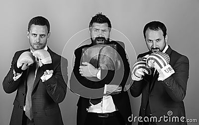 Man with beard and frightened face holds tight briefcase. Stock Photo