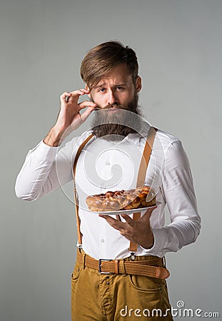 Man with a beard with a pie Stock Photo