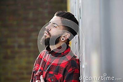 Man with beard standing outdoors alone Stock Photo