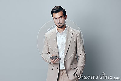 smartphone man phone call happy business beard smile hold suit portrait Stock Photo