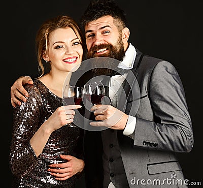 Man with beard and woman in shining dress celebrate Stock Photo