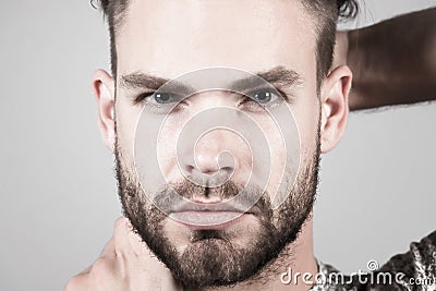 Man with bearded face skin, moustache on grey background Stock Photo