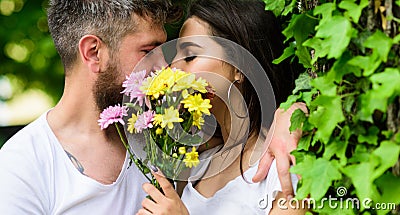 Man bearded hipster kisses girlfriend. Secret romantic kiss. Love romantic feelings. Moment of intimacy. Couple in love Stock Photo