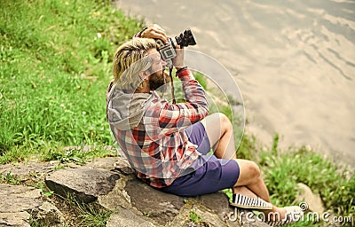 Man bearded hipster photographer hold vintage camera. Photographer concept. Photographer amateur photographer nature Stock Photo