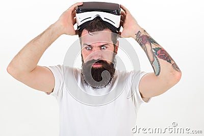 Man bearded hipster with virtual reality headset on white background isolated. Sensational feelings of using VR headset Stock Photo