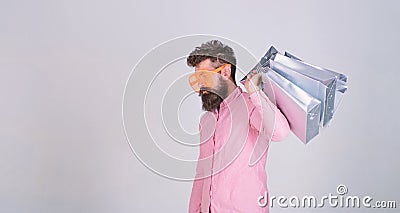 Man bearded hold shopping bags. Shopping dumb wasting money. Stupid things you do with your money. How to stop buying Stock Photo