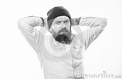 Man bearded with mustache brutal masculine appearance. Hipster style and fashion. Hipster bearded guy wear bright hat Stock Photo