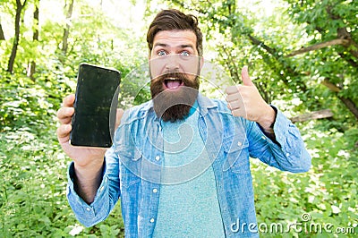 Man bearded wanderer walking in forest with navigation application. Route for exciting adventure. GPS and navigation Stock Photo